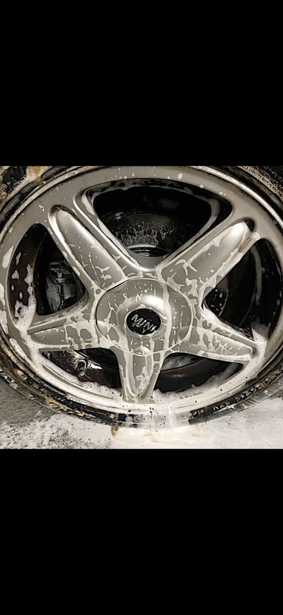 Before: Rim covered in brake dust and soap during cleaning